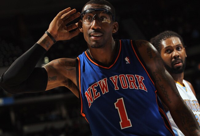 DENVER - NOVEMBER 16:  Amar'e Stoudemire #1 of the New York Knicks holds his hand to his ear as he attempts to engage the home team fans of the Denver Nuggets at the Pepsi Center on November 16, 2010 in Denver, Colorado. NOTE TO USER: User expressly acknowledges and agrees that, by downloading and/or using this Photograph, User is consenting to the terms and conditions of the Getty Images License Agreement.  (Photo by Doug Pensinger/Getty Images)