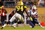 PITTSBURGH, PA - NOVEMBER 14:  Deion Branch #84 of the New England Patriots attempts to run by Lawrence Timmons #94 of the Pittsburgh Steelers during the game on November 14, 2010 at Heinz Field in Pittsburgh, Pennsylvania.  (Photo by Jared Wickerham/Getty Images)