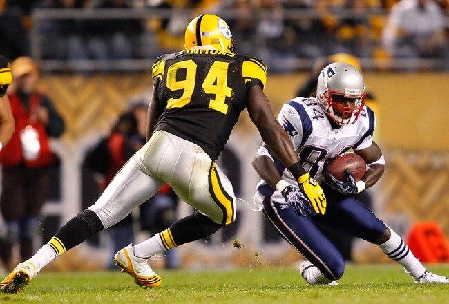 PITTSBURGH, PA - NOVEMBER 14:  Deion Branch #84 of the New England Patriots attempts to run by Lawrence Timmons #94 of the Pittsburgh Steelers during the game on November 14, 2010 at Heinz Field in Pittsburgh, Pennsylvania.  (Photo by Jared Wickerham/Getty Images)