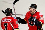 CALGARY, AB - APRIL 22: Jarome Iginla #12 and Dion Phaneuf #3 of the Calgary Flames celebrate Iginla's empty net goal to seal the win against the Chicago Blackhawks in Game Four of the Western Conference Quarterfinals of the 2009 Stanley Cup Playoffs on April 22, 2009 at the Pengrowth Saddledome in Calgary, Alberta, Canada. (Photo by Mike Ridewood/Getty Images)