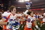 GLENDALE, AZ - JANUARY 01:  Seth Anderson (L) #36 and Aiona Key #84 of the Boise State Broncos celerbate a win over the Oklahoma Sooners 43-42 at the Tostito's Fiesta Bowl at University of Phoenix Stadium January 1, 2007 in Glendale, Arizona.  (Photo by Jonathan Ferrey/Getty Images)