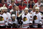 DETROIT - MAY 19:  (L-R) Martin Havlat #24, Troy Brouwer #22, Kris Versteeg #32, Head coach Joel Quennville, Dave Bolland #36 and Andrew Ladd #16 of the Chicago Blackhawks look on from the bench late in the game against the Detroit Red Wings during Game Two of the Western Conference Championship Round of the 2009 Stanley Cup Playoffs on May 19, 2009 at Joe Louis Arena in Detroit, Michigan.  (Photo by Dave Sandford/Getty Images)