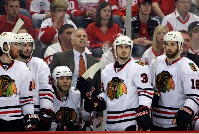 DETROIT - MAY 19:  (L-R) Martin Havlat #24, Troy Brouwer #22, Kris Versteeg #32, Head coach Joel Quennville, Dave Bolland #36 and Andrew Ladd #16 of the Chicago Blackhawks look on from the bench late in the game against the Detroit Red Wings during Game Two of the Western Conference Championship Round of the 2009 Stanley Cup Playoffs on May 19, 2009 at Joe Louis Arena in Detroit, Michigan.  (Photo by Dave Sandford/Getty Images)