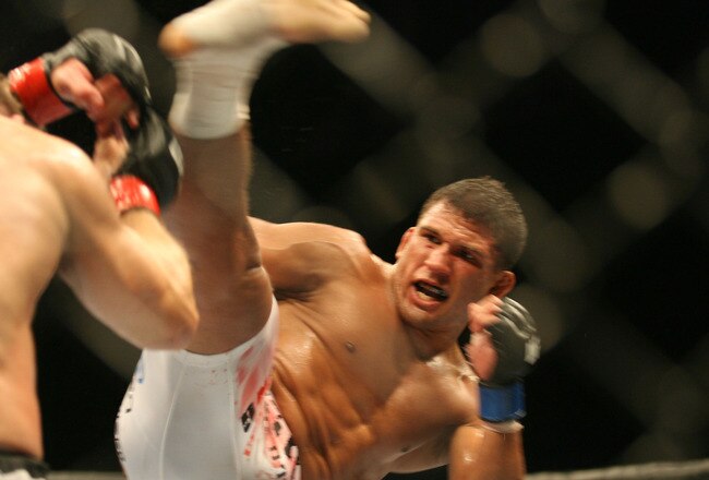 CHICAGO - OCTOBER 25:  Sean Sherk (L)  fights Tyson Griffin in a Lightweight bout at UFC's Ultimate Fight Night at Allstate Arena on October 25, 2008 in Chicago, Illinois. (Photo by Tasos Katopodis/Getty Images)