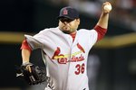 PHOENIX - JUNE 11:  Relief pitcher Dennys Reyes #36 of the St. Louis Cardinals pitches against the Arizona Diamondbacks during the Major League Baseball game at Chase Field on June 11, 2010 in Phoenix, Arizona. The Cardinals defeated the Diamondbacks 5-2.  (Photo by Christian Petersen/Getty Images)