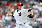NEW YORK - JULY 04:  Chien-Ming Wang #40 of the New York Yankees pitches against the Toronto Blue Jays on July 4, 2009 at Yankee Stadium in the Bronx borough of New York City.  (Photo by Nick Laham/Getty Images)