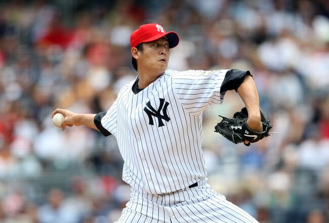 NEW YORK - JULY 04:  Chien-Ming Wang #40 of the New York Yankees pitches against the Toronto Blue Jays on July 4, 2009 at Yankee Stadium in the Bronx borough of New York City.  (Photo by Nick Laham/Getty Images)