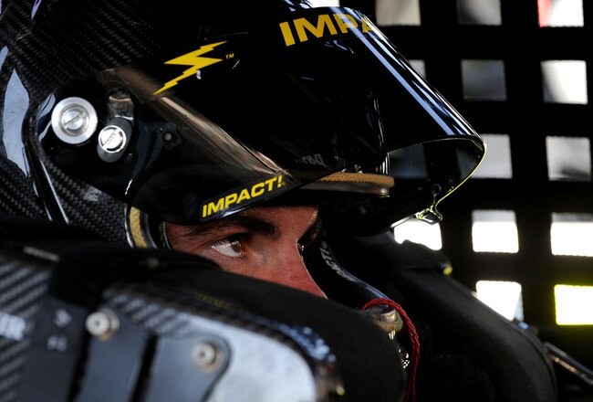 FORT WORTH, TX - NOVEMBER 05:  Mikey Kile sits in the #29 Greased Lightning Chevrolet in the garage area prior to practice for the NASCAR Camping World Truck Series WinStar World Casino 350 at Texas Motor Speedway on November 5, 2009 in Fort Worth, Texas.  (Photo by John Harrelson/Getty Images for NASCAR)