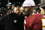 PHILADELPHIA - OCTOBER 03:  Donovan McNabb #5 of the Washington Redskins meets with head coach Andy Reid of the Philadelphia Eagles after their game on October 3, 2010 at Lincoln Financial Field in Philadelphia, Pennsylvania. The Redskins defeated the Eagles 17-12.  (Photo by Jim McIsaac/Getty Images)