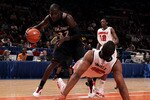 NEW YORK - MARCH 10: Samardo Samuels #15 of the Louisville Cardinals falls to the court against Ibrahima Thomas #32 of the Cincinnati Bearcats during the second round of 2010 NCAA Big East Tournament at Madison Square Garden on March 10, 2010 in New York City.  (Photo by Jim McIsaac/Getty Images)