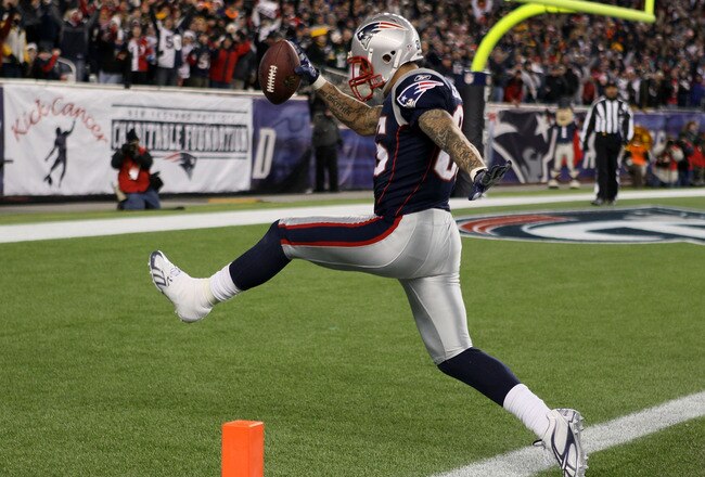 FOXBORO, MA - DECEMBER 19:  Tight end Aaron Hernandez #85 of the New England Patriots scores a touchdown after catching a pass from quarterback Tom Brady #12 (not pictured) in the fourth quarter of the game against the Green Bay Packers at Gillette Stadium on December 19, 2010 in Foxboro, Massachusetts.  (Photo by Elsa/Getty Images)