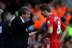 LIVERPOOL, ENGLAND - AUGUST 15:  Liverpool Manager Roy Hodgson issues instructions to Steven Gerrard during the Barclays Premier League match between Liverpool and Arsenal at Anfield on August 15, 2010 in Liverpool, England.  (Photo by Clive Brunskill/Getty Images)