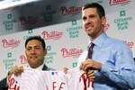 PHILADELPHIA - DECEMBER 15:  Pitcher Cliff Lee (R) #33 of the Philadelphia Phillies is introduced to the media and presented his jersey by the Philadelphia Phillies general manager Ruben Amaro Jr. during a press conference at Citizens Bank Park on December 15, 2010 in Philadelphia, Pennsylvania.  (Photo by Drew Hallowell/Getty Images)