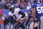 EAST RUTHERFORD, NJ - DECEMBER 19:  Michael Vick #7 of the Philadelphia Eagles rushes against the New York Giants at New Meadowlands Stadium on December 19, 2010 in East Rutherford, New Jersey.  (Photo by Nick Laham/Getty Images)
