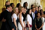 WASHINGTON - MAY 17:  U.S. President Barack Obama (C) poses for a picture with the NCAA champion University of Connecticut women�s basketball team during a ceremony in the East Room at the White House on May 17, 2010 in Washington, DC. The Huskies were invited to the White House to recognize their seventh overall and second straight NCAA championship and back-to-back undefeated seasons.  (Photo by Mark Wilson/Getty Images)