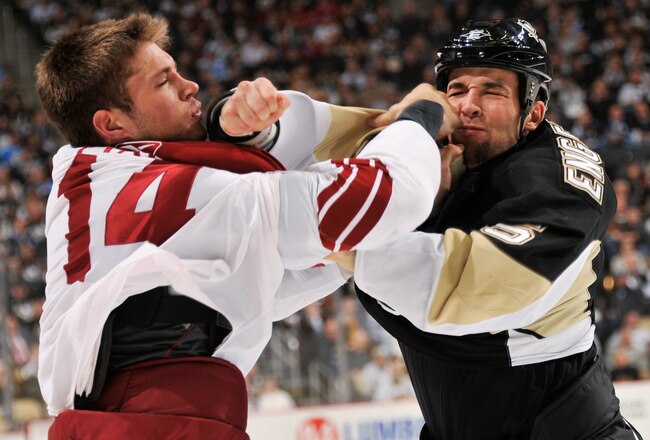 PITTSBURGH, PA - DECEMBER 20:  Deryk Engelland #5 of the Pittsburgh Penguins connects with his right hand on Taylor Pyatt #14 of the Phoenix Coyotes during a third period fight on December 20, 2010 at CONSOL Energy Center in Pittsburgh, Pennsylvania.  (Photo by Jamie Sabau/Getty Images)
