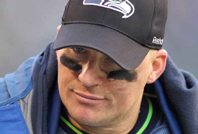 SEATTLE, WA - DECEMBER 19:  Quarterback Matt Hasselbeck #8 of the Seattle Seahawks looks on from the sidelines after being removed from the game in the second half against the Atlanta Falcons at Qwest Field on December 19, 2010 in Seattle, Washington. The Falcons defeated the Seahawks 34-18. (Photo by Otto Greule Jr/Getty Images)