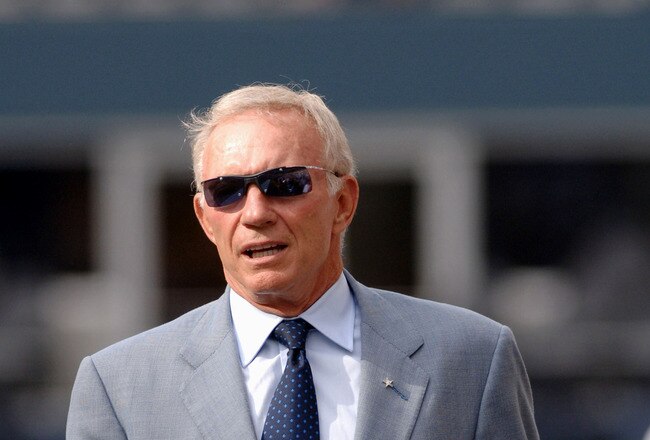Dallas Cowboys owner Jerry Jones checks the field before play against the Seattle Seahawks in a pre-season game August  22, 2005 in Seattle.  The Cowboys defeated the Seahawks 18 - 10.  (Photo by Al Messerschmidt/Getty Images)