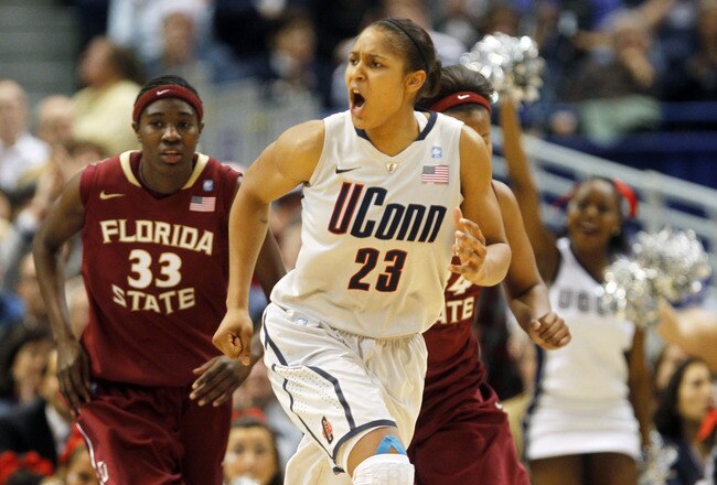 HARTFORD, CT - DECEMBER 21:  Maya Moore #23 of the Connecticut reacts in the final minutes of a win over Florida State on December 21, 2010 in Hartford, Connecticut.  Connecticut set a record with 89 straight wins without a defeat. (Photo by Jim Rogash/Getty Images)