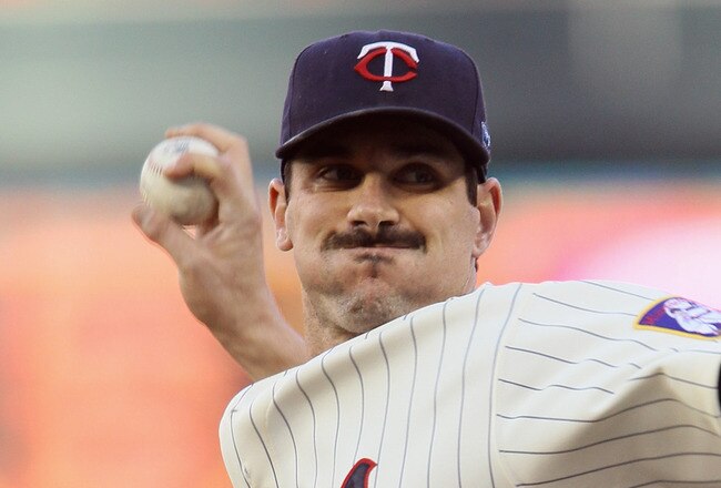MINNEAPOLIS - OCTOBER 07:  Carl Pavano #48 of the Minnesota Twins delivers a pitch in the first inning against the New York Yankees during game two of the ALDS on October 7, 2010 at Target Field in Minneapolis, Minnesota.  (Photo by Elsa/Getty Images)