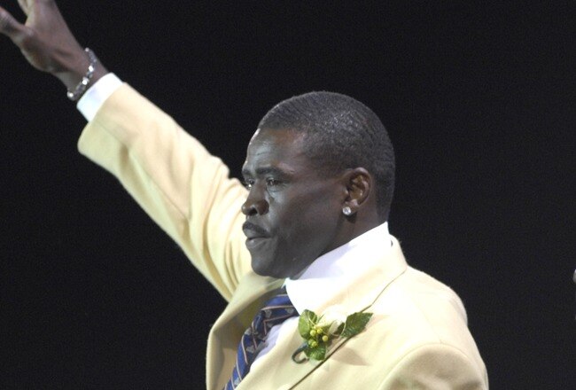 CANTON, OH - AUGUST 04: Michael Irvin waves to fans during the Class of 2007 Pro Football Hall of Fame Enshrinement Ceremony August 4, 2007 in Canton, Ohio. (Photo by Al Messerschmidt/Getty Images)