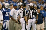 INDIANAPOLIS, IN - DECEMBER 19: Jim Caldwell of the Indianapolis Colts talks with Referee Mike Carey #94 and Tim Podraza #47 against the Jacksonville Jaguars at Lucas Oil Stadium on December 19, 2010 in Indianapolis, Indiana.  (Photo by Scott Boehm/Getty Images)