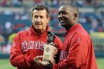 ANAHEIM, CA - APRIL 07:  Owner of the Los Angeles Angels of Anaheim Arturo Moreno presents Tony Reagins with the Andrew Foster Legacy Award before the game against the Oakland Athletics on April 7, 2009 in Anaheim, California.  (Photo by Lisa Blumenfeld/Getty Images)