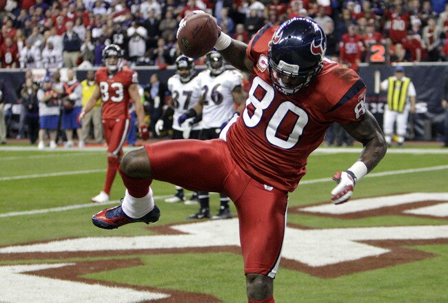 HOUSTON, TX - DECEMBER 13:  Wide receiver Andre Johnson #80 of the Houston Texans comes scores as he get's his foot down in the endzone in the fourth quarter against the Baltimore Ravens at Reliant Stadium on December 13, 2010 in Houston, Texas. Baltimore won 34-28 in overtime. (Photo by Bob Levey/Getty Images)