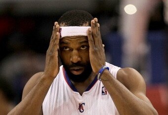 LOS ANGELES, CA - DECEMBER 22:  Baron Davis #5 of the Los Angeles Clippers adjusts his head band during the game with the Houston Rockets at Staples Center on December 22, 2010 in Los Angeles, California.  The Rockets won 97-92. NOTE TO USER: User expressly acknowledges and agrees that, by downloading and or using this photograph, User is consenting to the terms and conditions of the Getty Images License Agreement. (Photo by Stephen Dunn/Getty Images)