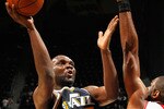 ATLANTA - NOVEMBER 12:  Al Jefferson #25 of the Utah Jazz against Al Horford #15 of the Atlanta Hawks at Philips Arena on November 12, 2010 in Atlanta, Georgia.  NOTE TO USER: User expressly acknowledges and agrees that, by downloading and/or using this Photograph, User is consenting to the terms and conditions of the Getty Images License Agreement.  (Photo by Kevin C. Cox/Getty Images)