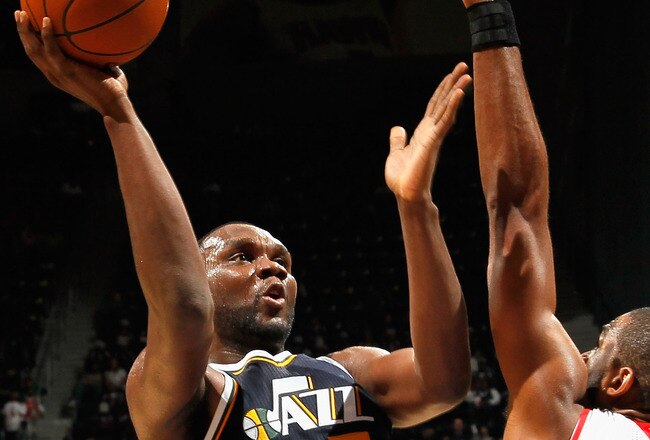 ATLANTA - NOVEMBER 12:  Al Jefferson #25 of the Utah Jazz against Al Horford #15 of the Atlanta Hawks at Philips Arena on November 12, 2010 in Atlanta, Georgia.  NOTE TO USER: User expressly acknowledges and agrees that, by downloading and/or using this Photograph, User is consenting to the terms and conditions of the Getty Images License Agreement.  (Photo by Kevin C. Cox/Getty Images)