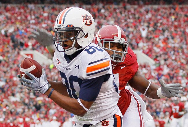 TUSCALOOSA, AL - NOVEMBER 26:  Emory Blake #80 of the Auburn Tigers pulls in this touchdown against Mark Barron #4 of the Alabama Crimson Tide at Bryant-Denny Stadium on November 26, 2010 in Tuscaloosa, Alabama.  (Photo by Kevin C. Cox/Getty Images)