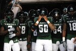 HONOLULU - SEPTEMBER 02: Mana Lolotai #50 of the University of Hawaii Warriors checks his helmet before the Warriors take the field in their season opener against the University of Southern California Trojans at Aloha Stadium September 2, 2010 in Honolulu, Hawaii. (Photo by Kent Nishimura/Getty Images)