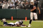 OAKLAND, CA - DECEMBER 19:  Jason Campbell #8 of the Oakland Raiders escapes a diving Jason Hunter #52 of the Denver Broncos at Oakland-Alameda County Coliseum on December 19, 2010 in Oakland, California.  (Photo by Ezra Shaw/Getty Images)