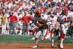 SAN FRANCISCO - SEPTEMBER 30:  Running back Lynn Cain #21 takes the hand off from quarterback Steve Bartkowski #10 of the Atlanta Falcons during a game against the San Francisco 49ers at Candlestick Park on September 30, 1984 in San Francisco, California.  The 49ers won 14-5.  (Photo by George Rose/Getty Images)