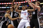 LOS ANGELES, CA - DECEMBER 01:  Eric Gordon #10 of the Los Angeles Clippers has the ball knocked away by Tim Duncan #21, Matt Bonner #15 and George Hill #3 of the San Antonio Spurs Los Angeles at the Staples Center on December 1, 2010 in Los Angeles, California.  NOTE TO USER: User expressly acknowledges and agrees that, by downloading and or using this photograph, User is consenting to the terms and conditions of the Getty Images License Agreement.  (Photo by Harry How/Getty Images)