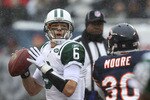 CHICAGO, IL - DECEMBER 26: Mark Sanchez #6 of the New York Jets drops back to pass as D.J. Moore #30 of the Chicago Bears blitezes at Soldier Field on December 26, 2010 in Chicago, Illinois. The Bears defeated the Jets 38-34. (Photo by Jonathan Daniel/Getty Images)