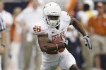 HOUSTON - SEPTEMBER 04:  Running back Fozzy Whitaker #28 of the Texas Longhorns rushes against the Rice Owls at Reliant Stadium on September 4, 2010 in Houston, Texas.  (Photo by Bob Levey/Getty Images)