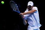 LONDON, ENGLAND - NOVEMBER 26:  Andy Roddick of the USA returns the ball during his men's singles match against Novak Djokovic of Serbia during the ATP World Tour Finals at O2 Arena on November 26, 2010 in London, England.  (Photo by Julian Finney/Getty Images)