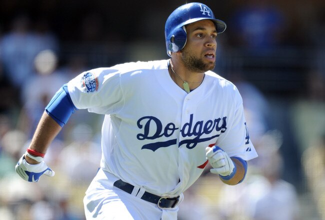 LOS ANGELES, CA - SEPTEMBER 01:  James Loney #7 of the Los Angeles Dodgers runs to first base against the Philadelphia Phillies at Dodger Stadium on September 1, 2010 in Los Angeles, California.  (Photo by Harry How/Getty Images)