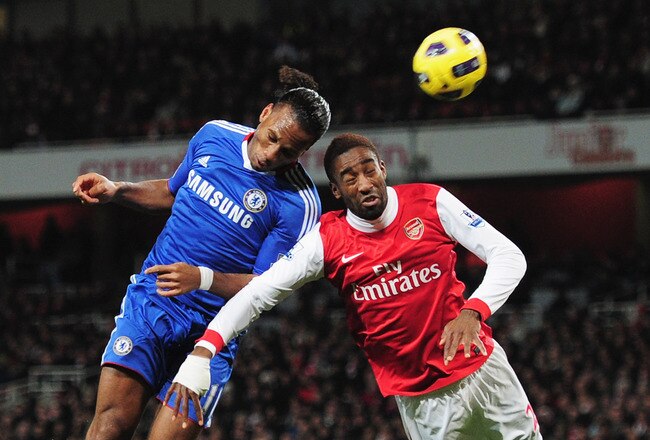 LONDON, ENGLAND - DECEMBER 27:  Didier Drogba of Chelsea wins a header against Johan Djourou of Arsenal during the Barclays Premier League match between Arsenal and Chelsea at the Emirates Stadium on December 27, 2010 in London, England.  (Photo by Shaun Botterill/Getty Images)