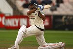 MANCHESTER, ENGLAND - AUGUST 12:  VVS Laxman of Lancashire hits the ball towards the boundary during the LV County Championship Division One match between Lancashire and Durham at Old Trafford on August 12, 2009 in Manchester, England.  (Photo by Matthew Lewis/Getty Images)