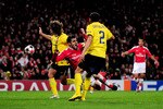 LONDON, ENGLAND - MARCH 31:  Cesc Fabregas of Arsenal is brought down by Carles Puyol (L) of Barcelona to win a penalty for his team during the UEFA Champions League quarter final first leg match between Arsenal and FC Barcelona at the Emirates Stadium on March 31, 2010 in London, England. Fabregas converted the penalty for Arsenal to level the scores at 2-2, while Carles Puyol of Barcelona was shown a red card. (Photo by Shaun Botterill/Getty Images)