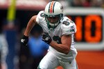 MIAMI - DECEMBER 19:  Receiver Kevin Curtis #83 of the Miami Dolphins runs against the Buffalo Bills at Sun Life Stadium on December 19, 2010 in Miami, Florida. The Bills defeated the Dolphins 17-14.  (Photo by Marc Serota/Getty Images)
