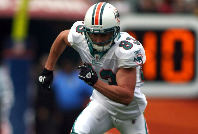 MIAMI - DECEMBER 19:  Receiver Kevin Curtis #83 of the Miami Dolphins runs against the Buffalo Bills at Sun Life Stadium on December 19, 2010 in Miami, Florida. The Bills defeated the Dolphins 17-14.  (Photo by Marc Serota/Getty Images)