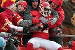 KANSAS CITY, MO - DECEMBER 26:  Receiver Dwayne Bowe #82 of the Kansas City Chiefs is congratulated by fans as he jumps into the stands after making a 75 yard touchdown catch during the game against the Tennessee Titans on December 26, 2010 at Arrowhead Stadium in Kansas City, Missouri.  (Photo by Jamie Squire/Getty Images)