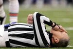 BALTIMORE - JANUARY 2:  Referee Bernie Kukar tries to collect himself after colliding with a member of the Miami Dolphins as the Baltimore Ravens defeated the Dolphins 30-23 during NFL action at M&T Bank Stadium on January 2, 2005 in Baltimore, Maryland.  (Photo by Doug Pensinger/Getty Images)
