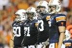 AUBURN, AL - SEPTEMBER 20:  Offensive lineman Ryan Pugh #50, Tyronne Green #71, Lee Ziemba #73 and tight end Tommy Trott #5 of the Auburn Tigers prepare for a play while taking on the LSU Tigers at Jordan-Hare Stadium on September 20, 2008 in Auburn, Alabama. LSU defeated Auburn 26-21.  (Photo by Doug Benc/Getty Images)