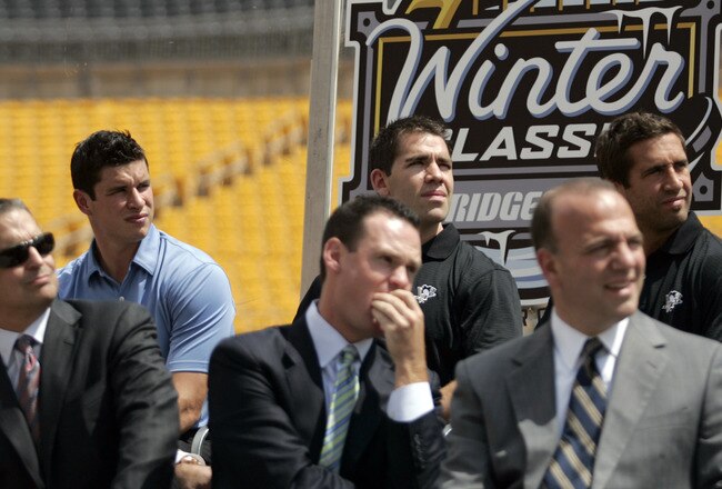 PITTSBURGH - JULY 27:  Sidney Crosby, Pascal Dupuis and Maxime Talbot of the Pittsburgh Penguins watch highlights of past Winter Classics at the 2011 Bridgestone NHL Winter Classic press conference on July 27, 2010 at Heinz Field in Pittsburgh, Pennsylvania.  (Photo by Justin K. Aller/Getty Images)