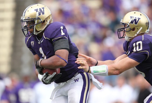 SEATTLE - SEPTEMBER 18: Quarterback Jake Locker #10 of the Washington Huskies hands off to Chris Polk #1 during the game against the Nebraska Cornhuskers on September 18, 2010 at Husky Stadium in Seattle, Washington. (Photo by Otto Greule Jr/Getty Images)